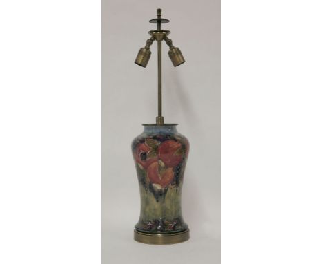 A Moorcroft 'Pomegranate' table lamp, with brass mounts and twin bulb fitting, 32cm vase 69cm high overall