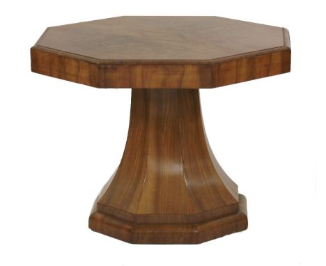 An Art Deco walnut lamp table, the octagonal top over a tapering column on a raised plinth, 59.5cm wide 45.5cm high