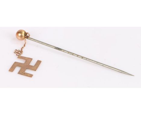 Stick pin, with a 9 carat gold surya symbol 