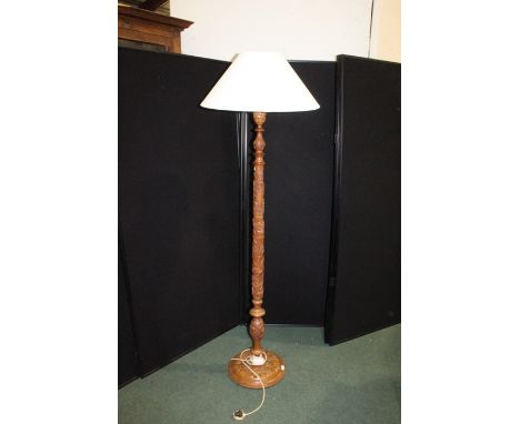 Carved standard lamp, carved with rows of animals