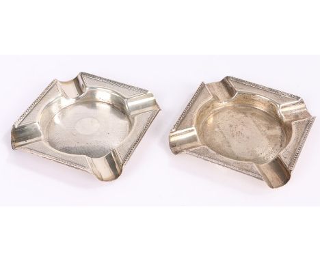 Pair of George V silver ashtrays, Birmingham 1930, makers Walker &amp; Hall, with engine turned beaded borders, 2.2oz