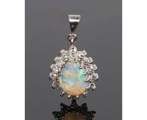 18 carat white gold diamond and opal pendant, with a pear cut opal and diamond surround, 19mm long including the loop