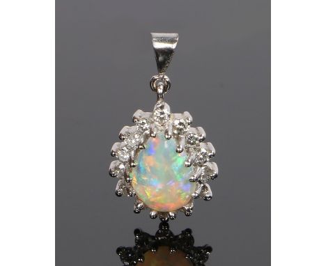 18 carat white gold diamond and opal pendant, with a pear cut opal and diamond surround, 19mm long including the loop