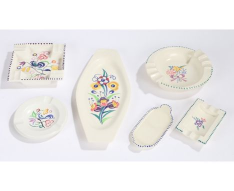 Four Poole pottery ashtrays, two shaped Poole pottery dishes (6)