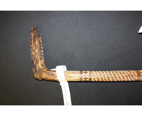 African tribal stick, the handle carved in the form of a shoe, with diamond and line carved shaft, 96cm long