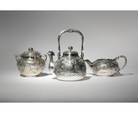 A JAPANESE THREE-PIECE SILVER TEA SET MEIJI PERIOD OR LATER, 19TH OR 20TH CENTURY Comprising: a teapot and cover, the spout i