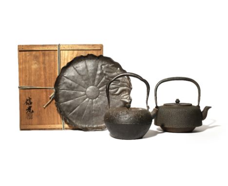 TWO JAPANESE CAST-IRON KETTLES AND COVERS, TETSUBIN MEIJI PERIOD OR LATER, 19TH OR 20TH CENTURY One with a rough ishime (ston