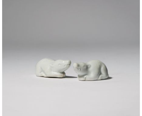 TWO JAPANESE HIRADO NETSUKE MEIJI PERIOD, 19TH CENTURY Modelled as two wild boarlets crouching, both with their heads slightl