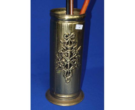 EMBOSSED BRASS STICK STAND AND TWO SMALL BRASS TRAYS 
together with three walking sticks