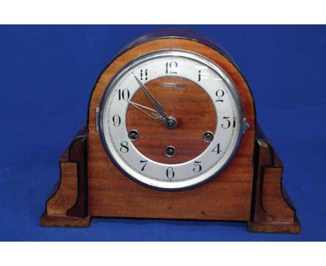 MID-20TH CENTURY MAHOGANY MANTEL CLOCK
made by Henderson, steel chapter with black Arabic numerals
