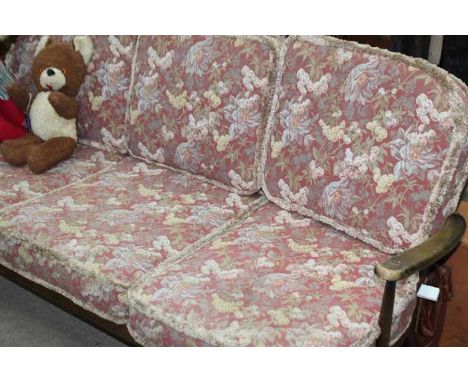 ERCOL-STYLE THREE-SEATER SOFA
with floral upholstery