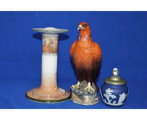 THREE DECORATIVE CERAMICS
comprising of a Beswick Eagle decanter, a Royal Doulton Dickins Ware candlestick, and a Tunstall pr