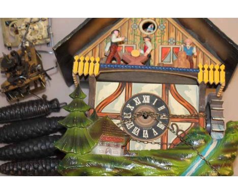 COLLECTION OF CUCKOO CLOCKS
including a larger example with stag head pediment, another larger cuckoo clock with quartz movem