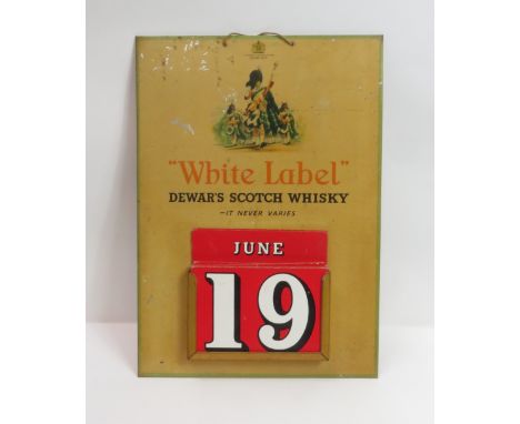 A  vintage advertising calendar for “White label Dewar's Scotch Whisky” 