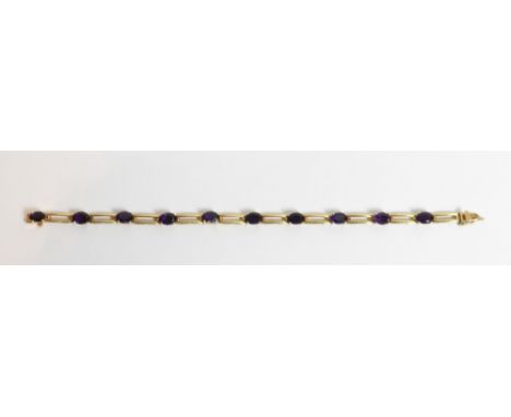 An amethyst set bracelet, stamped 'K14' to the clasp, 18 cm long, 10.3 g gross