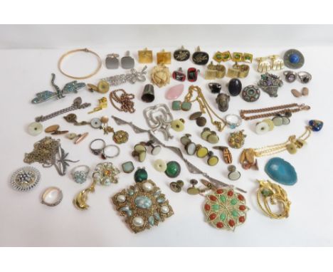 A large collection of costume jewellery, includes some signed pieces; with a plain jade bangle