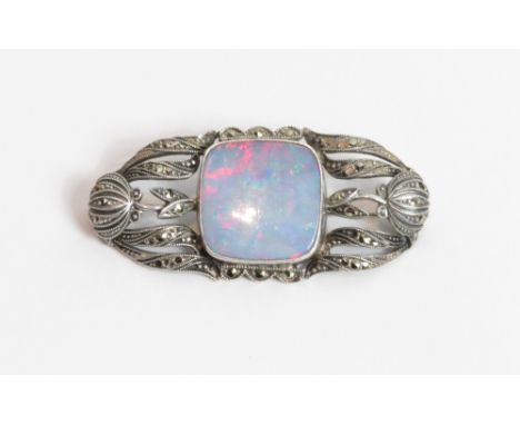 An opal doublet and marcasite set brooch, stamped '935', possibly German, 4.7 cm long by 2.2 cm, doublet approximately 1.6 cm