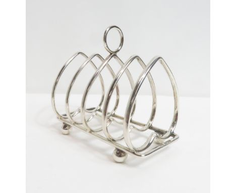 A late Victorian silver toast rack, by Harrison Brothers and Howson, Sheffield 1898, with five inverted heart shaped dividers