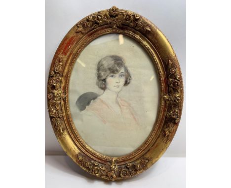 Early 20th Century English School - Portrait of a young woman, head and shoulders, watercolour, in oval gilt frame, 31.5cm x 