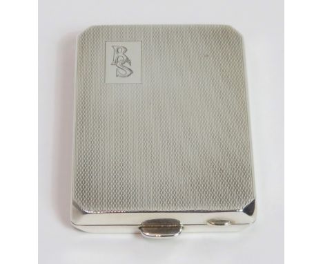 A silver book of matches case, with engine turned decoration and monogrammed, 38 g (1.2 troy ozs) gross