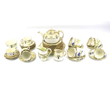 A Staffordshire porcelain part tea service and a Royal Worcester part tea service. The Royal Worcester example including a te