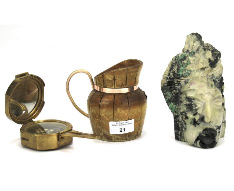 A 20th century compass, wooden jug and stone figure. The compass marked 'Stanley', the jug decorated with copper fruit and ha