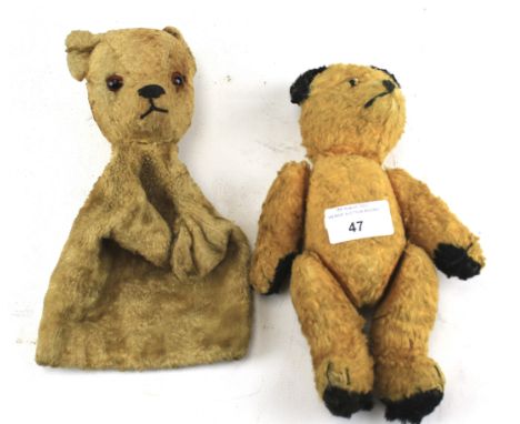 A 1950s Sooty teddy bear and a teddy puppet. The first jointed with clear glass eyes, 22cm high, the plush puppet with amber 