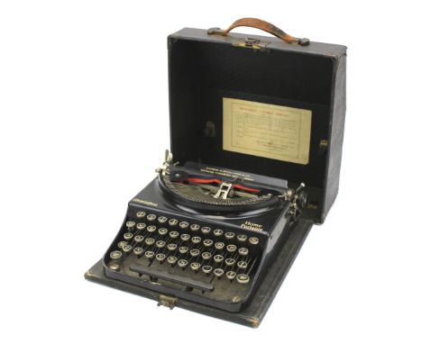 A vintage Remington Home Portable typewriter. In the original box with the paper label