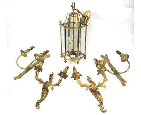 A metal framed hallway hanging light and two pairs of gilt wall sconces. The lantern of hexagonal form with glass panels and 