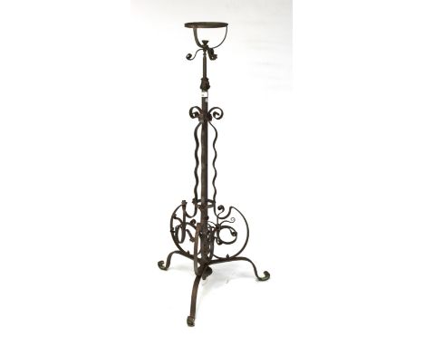 A 20th century cast metal adjustable standard lamp. Raised upon tripod cabriole supports, approximately 123cm high in current