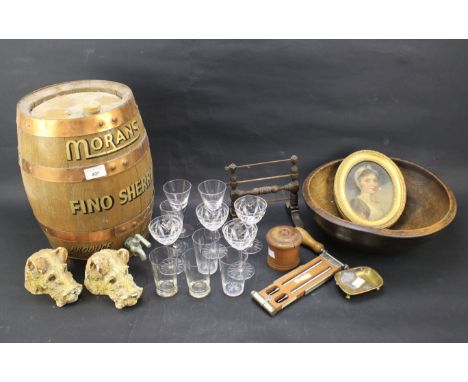 An assortment of collectables. Including a turned wooden bowl, framed portrait, two plaster models of dogs' heads, etc