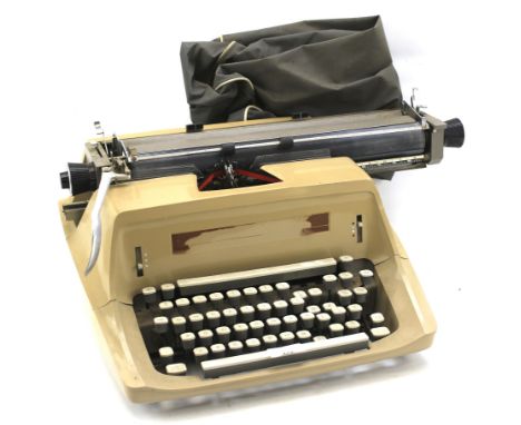 A Remington Sperry Rand typewriter. In light brown, L52cm