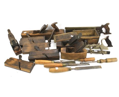 An assortment of vintage tools. Including a Drabble &amp; Sanderson and W Symes saw, plough plane and wooden handled chisels