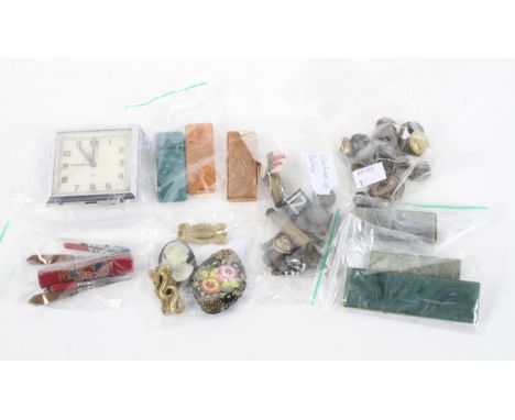 An assortment of collectables. Including military buttons, a Smiths travelling clock, a cameo, manicure sets, etc