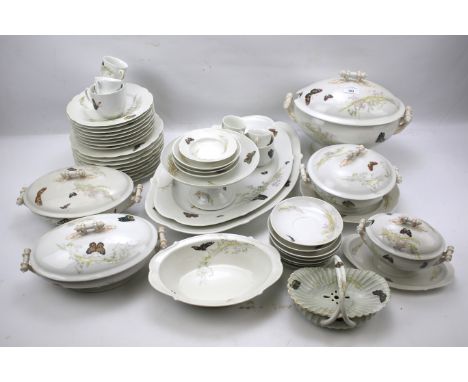 A Limoges part tea and dinner service. Circa 1900, including cups and saucers, plates, platters, tureens, etc, all decorated 