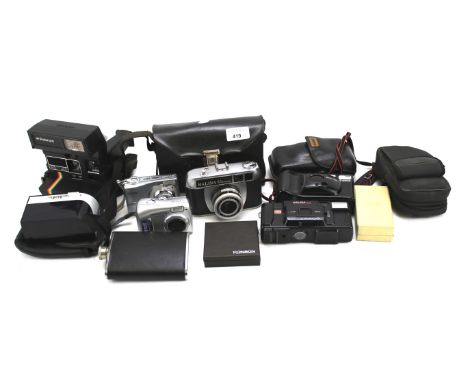 An assortment of collectables. Including cameras, a hip flask, Ronson lighter, etc