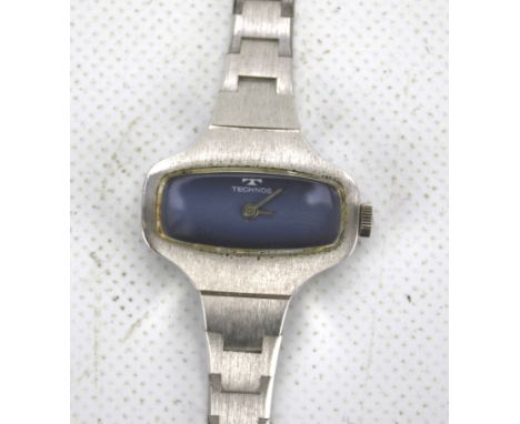 A vintage Technos ladies wristwatch. Stainless steel strap and case, in original box