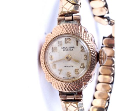 A ladies 9ct gold cased Excalibur manual wind cocktail wristwatch. The dial with gilt Arabic numerals denoting hours, on orig