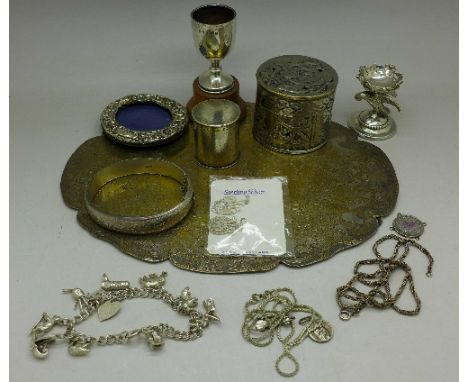 Silver and white metal items including a silver trophy, bangle and picture frame