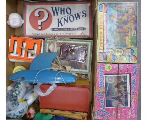 A collection of 1960's games and toys including a Pelham puppet, a pond yacht and jigsaw puzzles