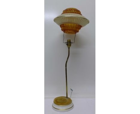 A Pirineo table lamp with UFO style shade