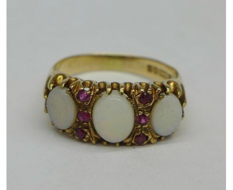 A 9ct gold, ruby and opal ring, 4.6g, U