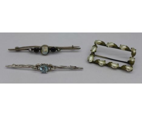 A 9ct white gold and blue stone brooch, 2.4g, and two blister pearl brooches