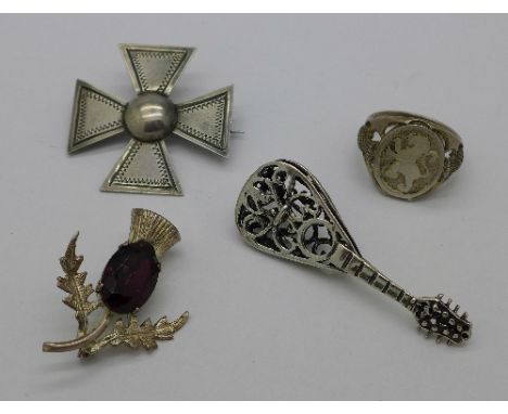 A Swedish silver brooch, a silver thistle brooch, an 800 silver mandolin pendant and a silver ring