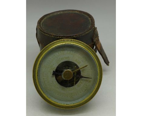 A pocket barometer with leather case
