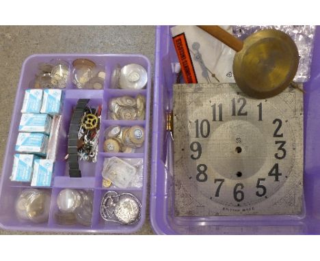 A box of watch crystals and clock parts