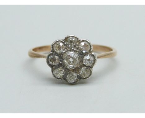 A Victorian diamond cluster ring with gold shank and silver setting, 1.7g, N/O 