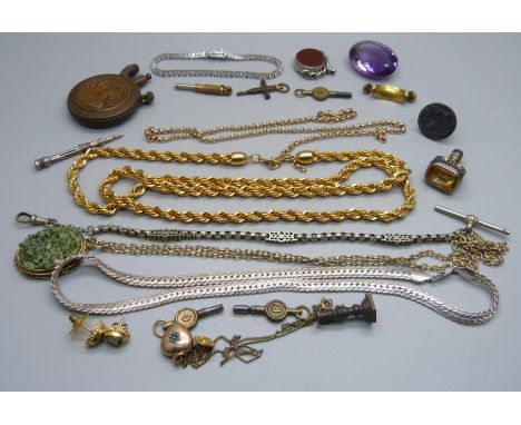 An early 20th Century lighter, chains, swivel fob, stone set bracelet, watch keys, etc. 