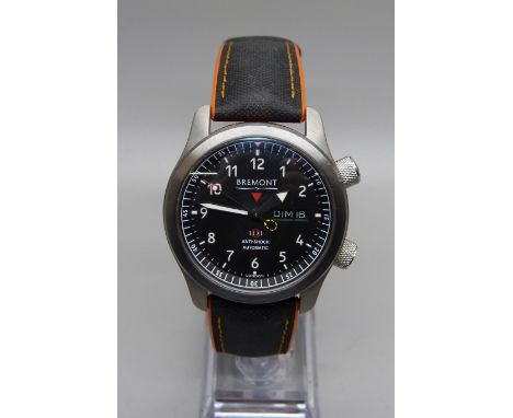 A Bremont MBII-BK10R Martin-Baker Ejection Seat wristwatch, serial number MN11/9865, with matching cufflinks, leather wallet,