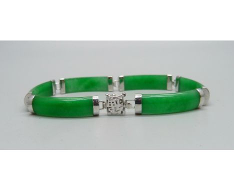 A 14ct white gold mounted jade bracelet 